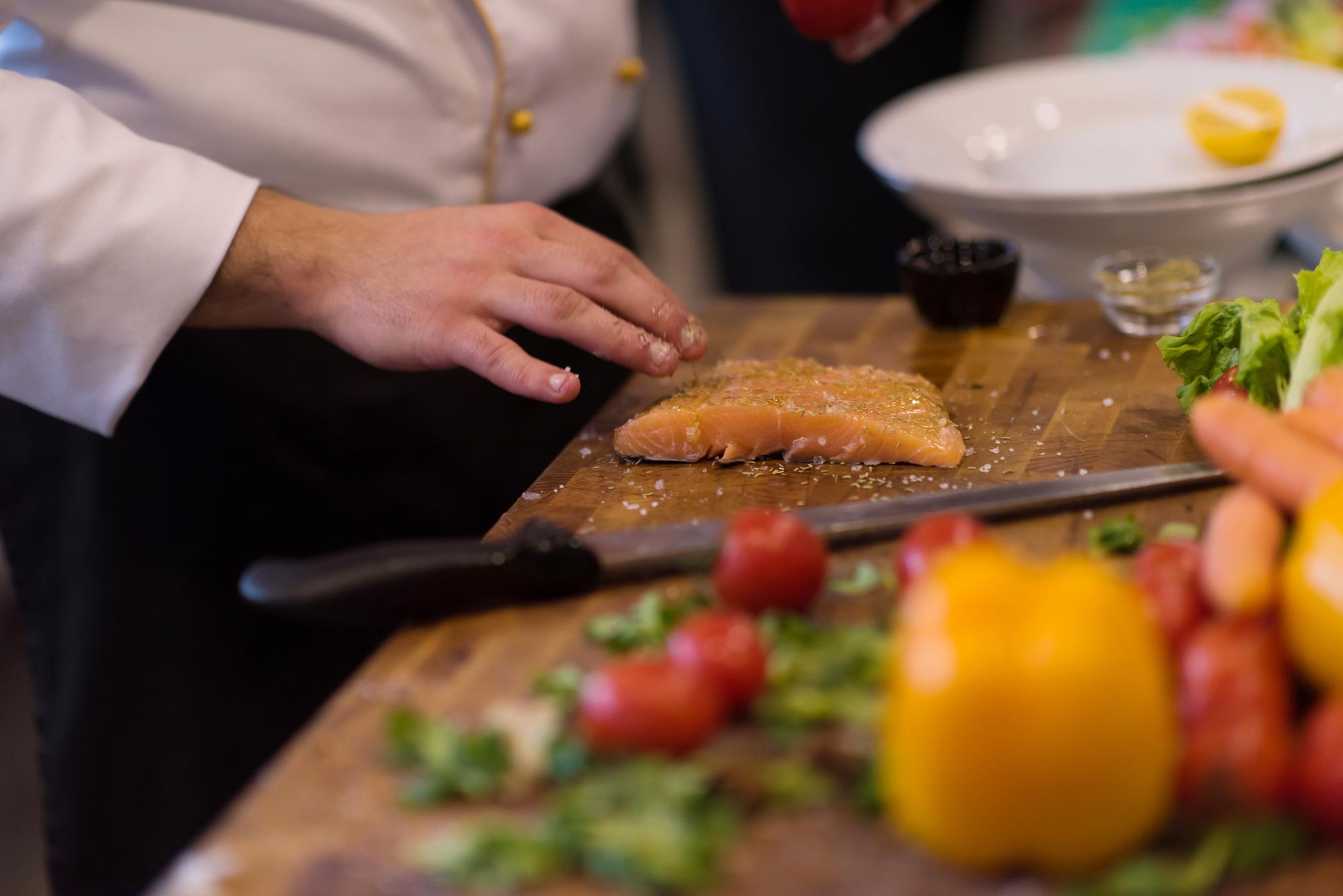 Assistant chef preparing ingredients